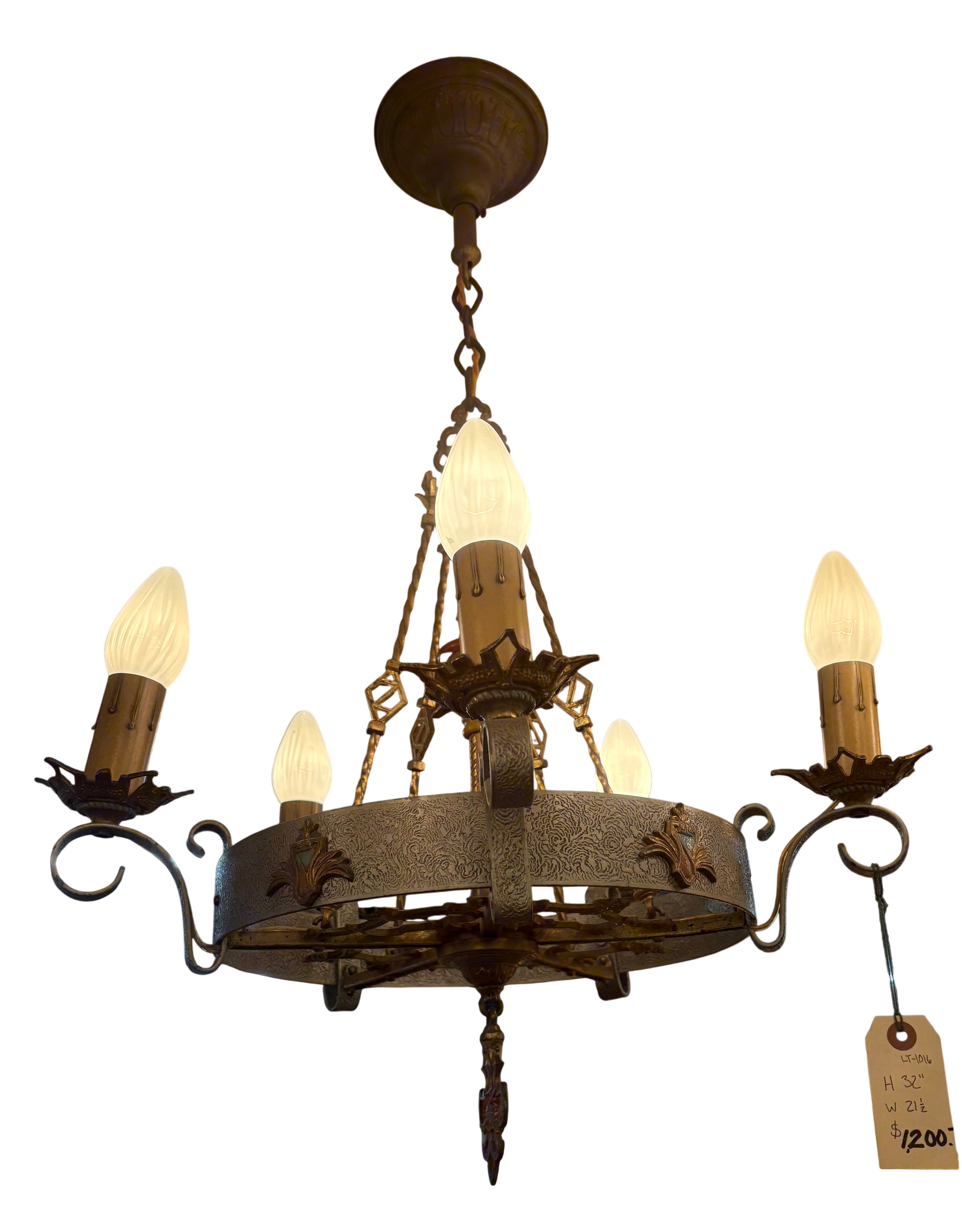 Vintage-style chandelier with multiple light bulbs hanging from the ceiling.