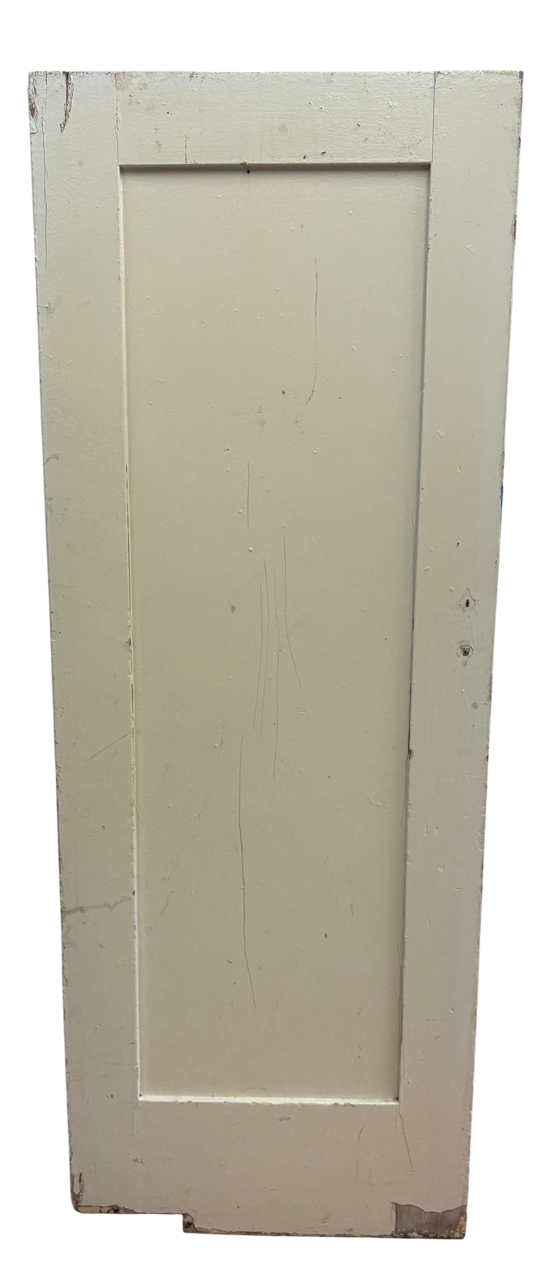 Vintage wooden door with a white finish on a white background