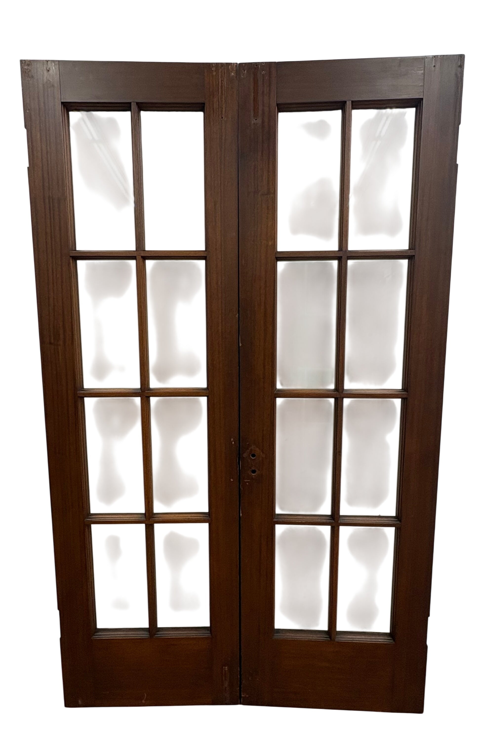 Wooden French doors with glass panels on a white background