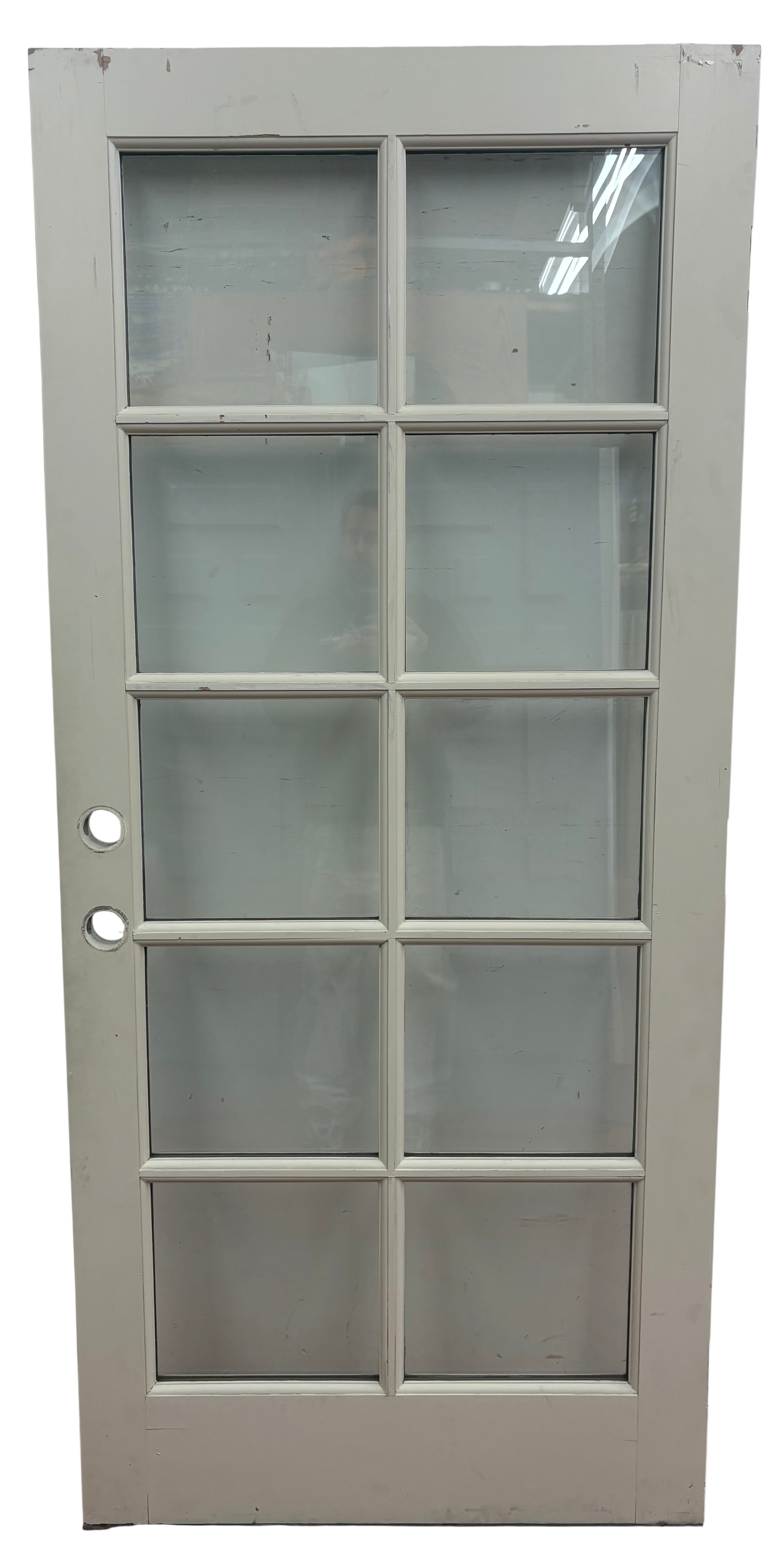 Glass door with a white frame on a white background