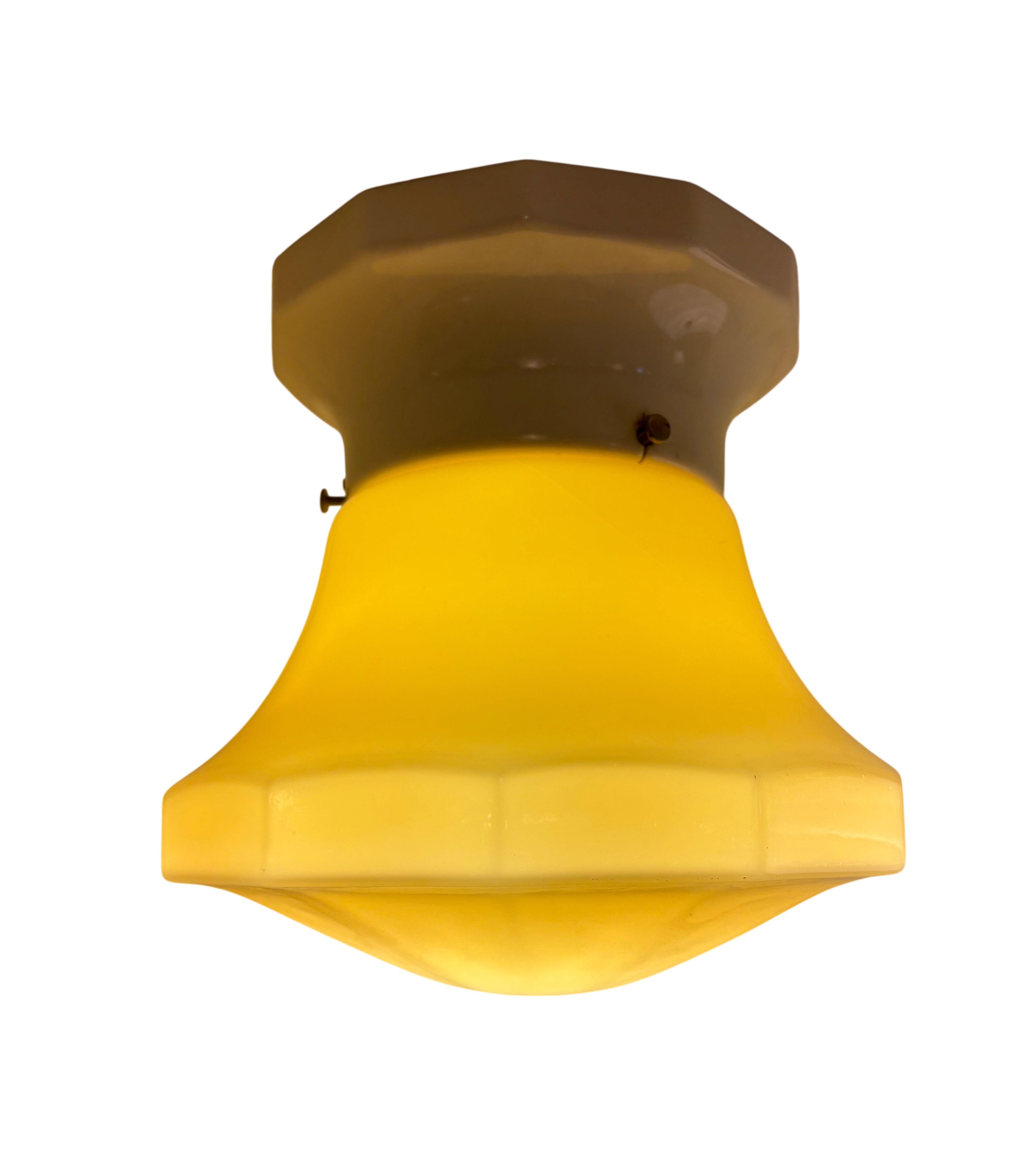 Yellow ceiling light fixture on a white background