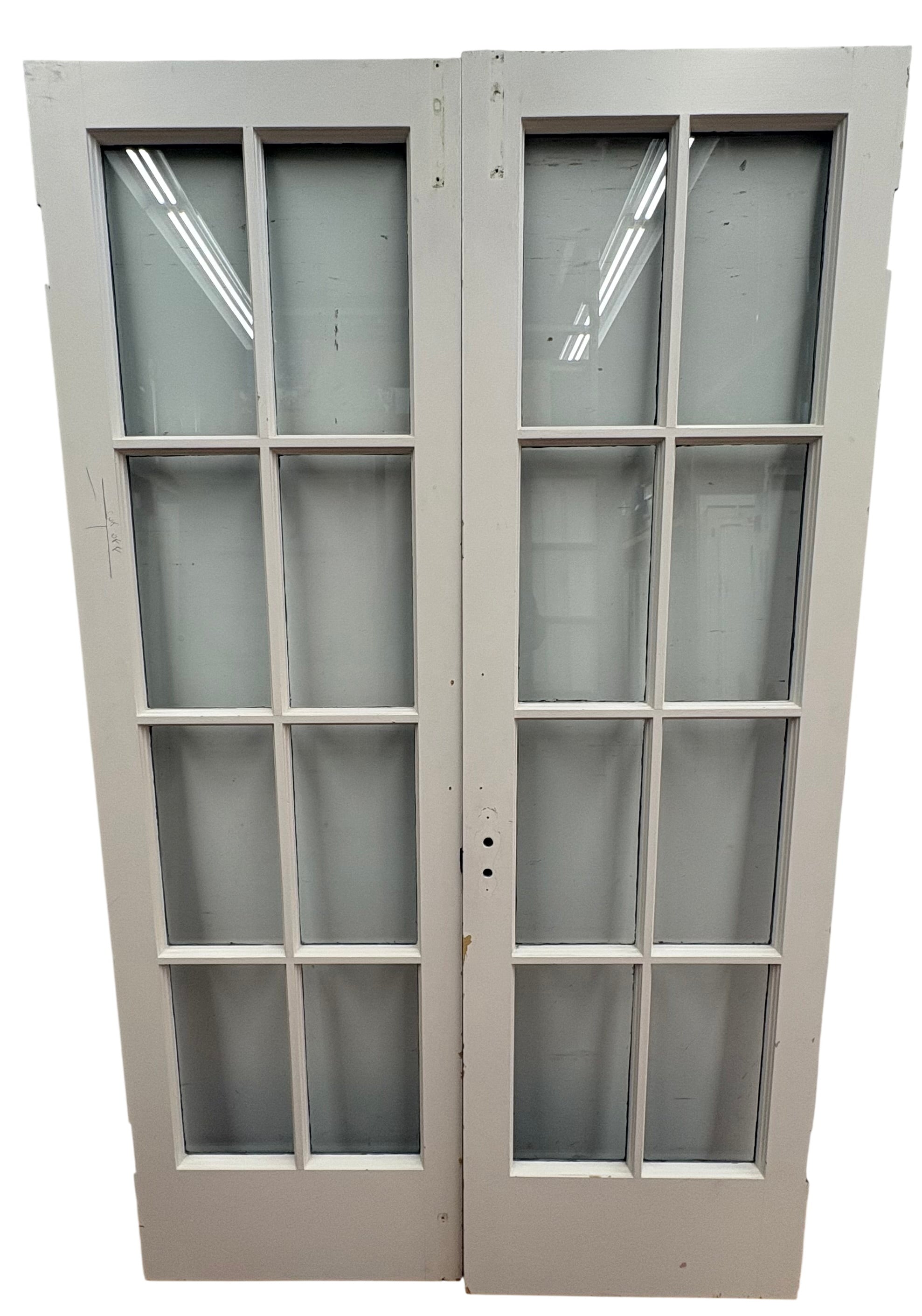 Pair of glass doors with a grid pattern on a white background