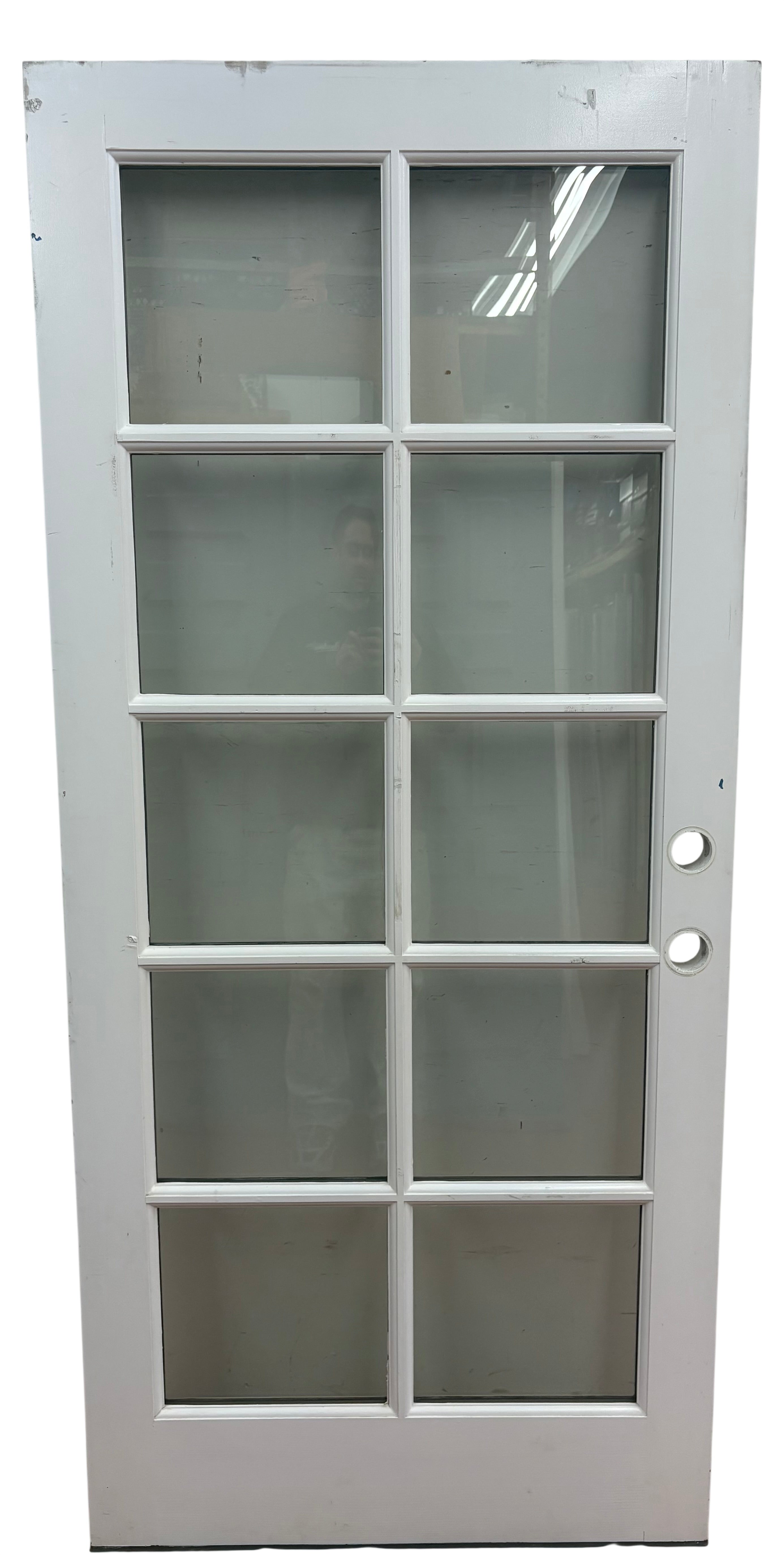 White door with glass panels on a white background
