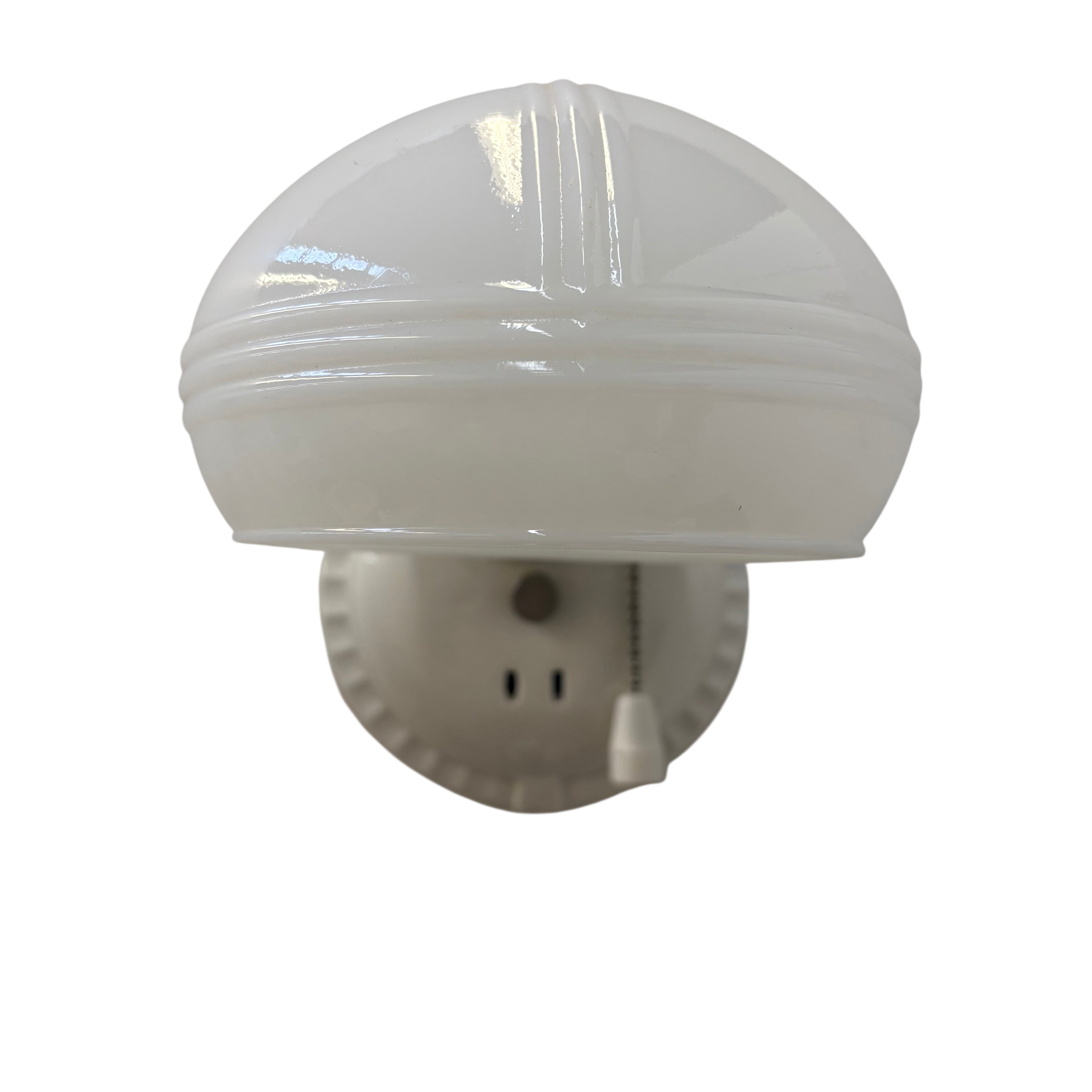 White porcelain sconce with shade and outlet on a white background