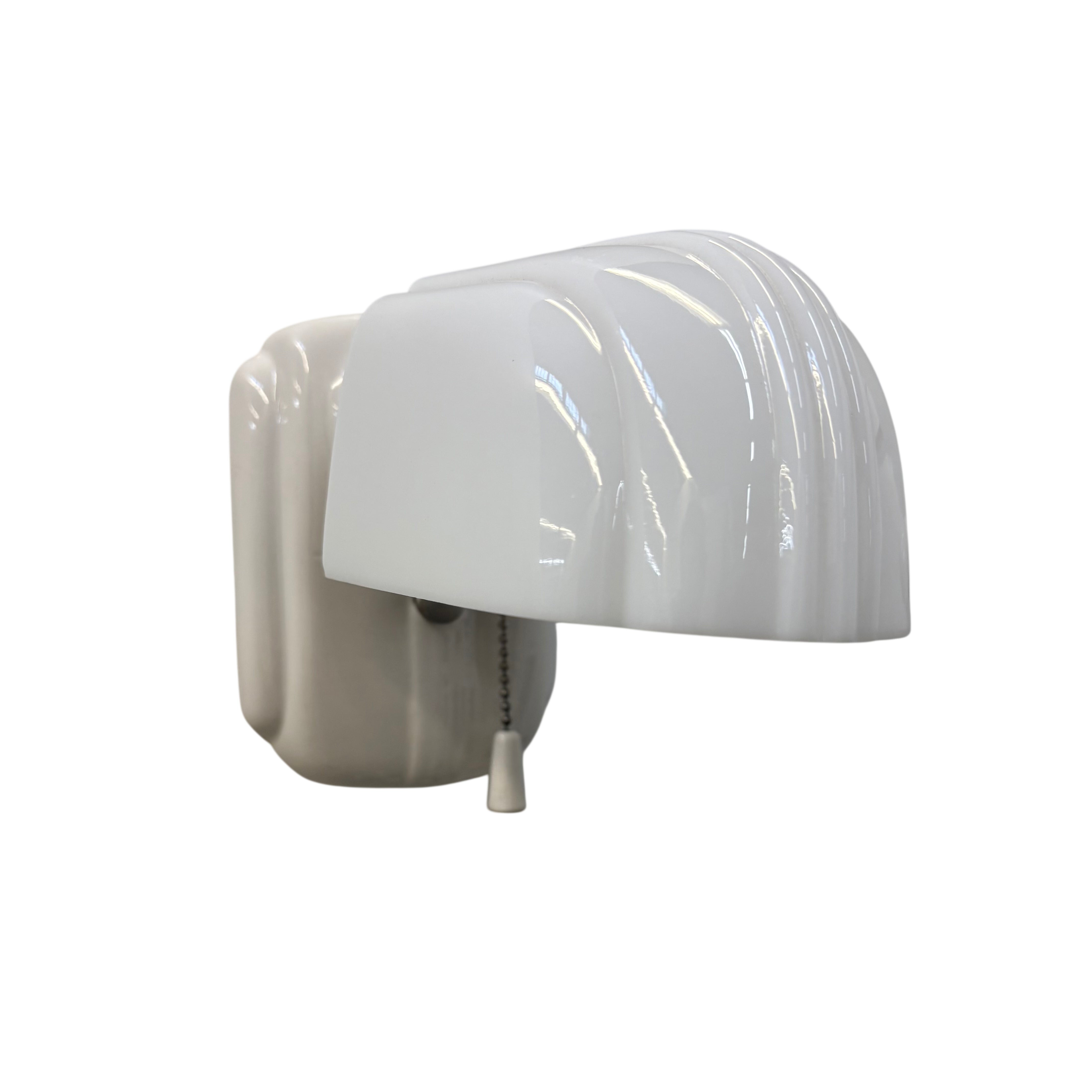 White porcelain sconce with shade on a white background