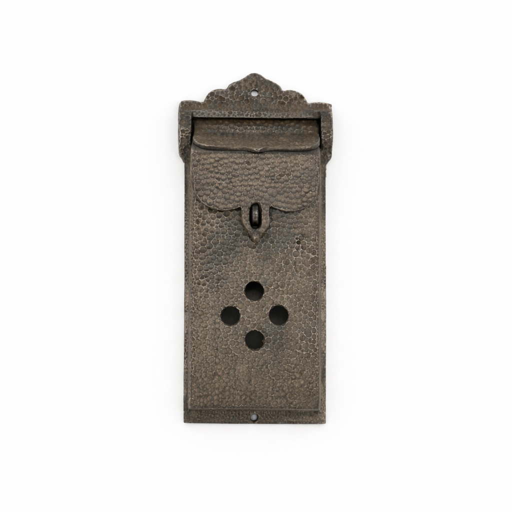 Decorative metal mailbox on a white background