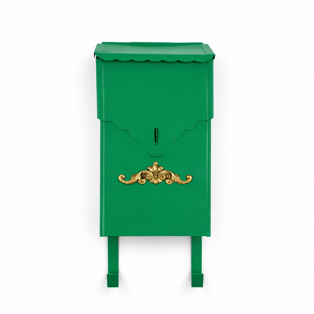 Green mailbox with gold decorative element on a white background