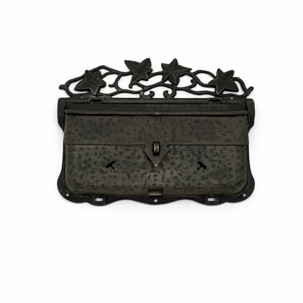 Decorative black metal box with star designs on a white background