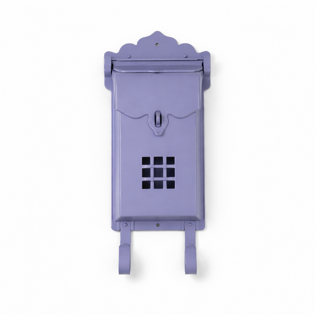 Decorative purple mailbox with a white background