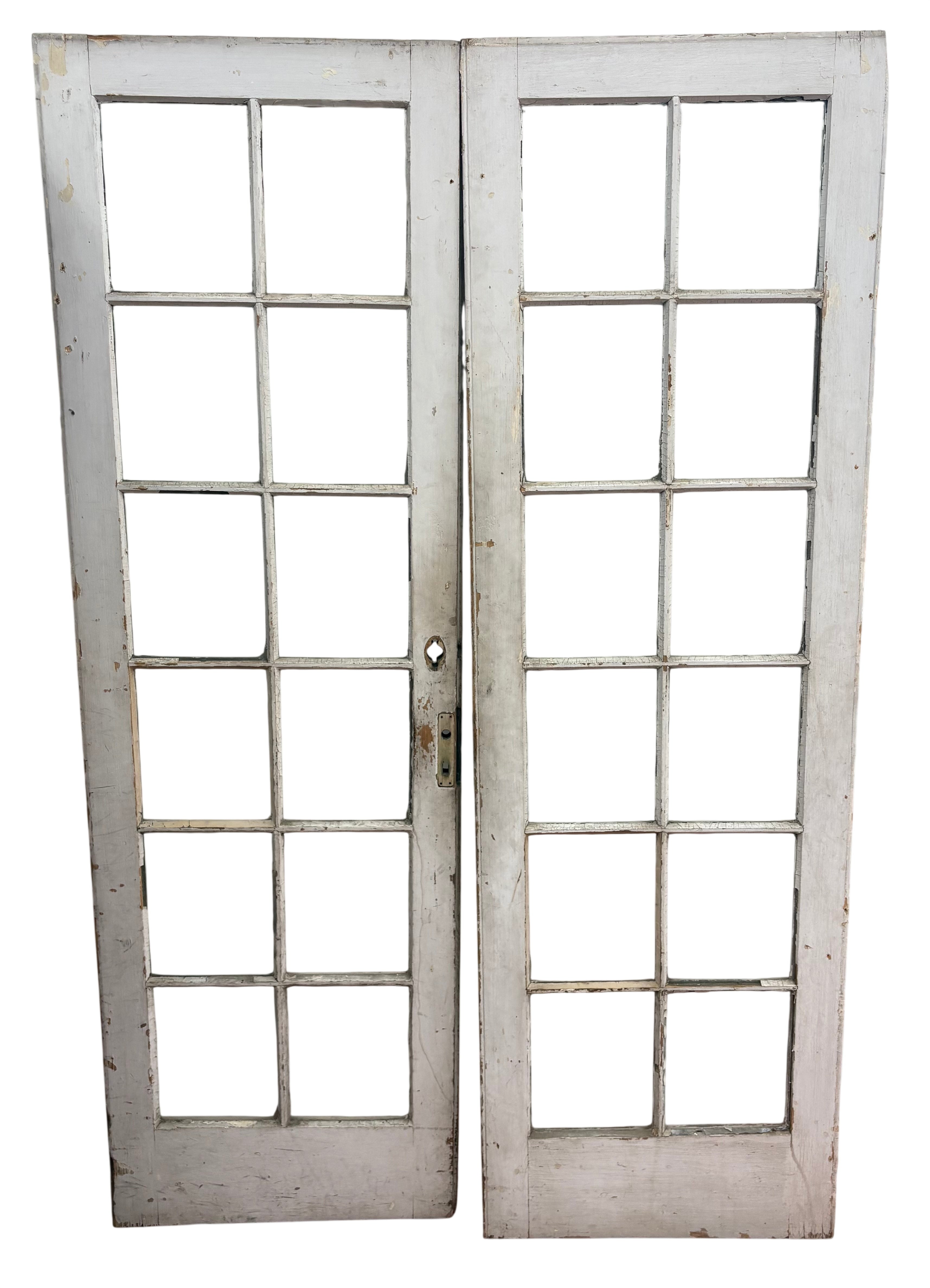 Pair of vintage glass doors with a white frame on a white background