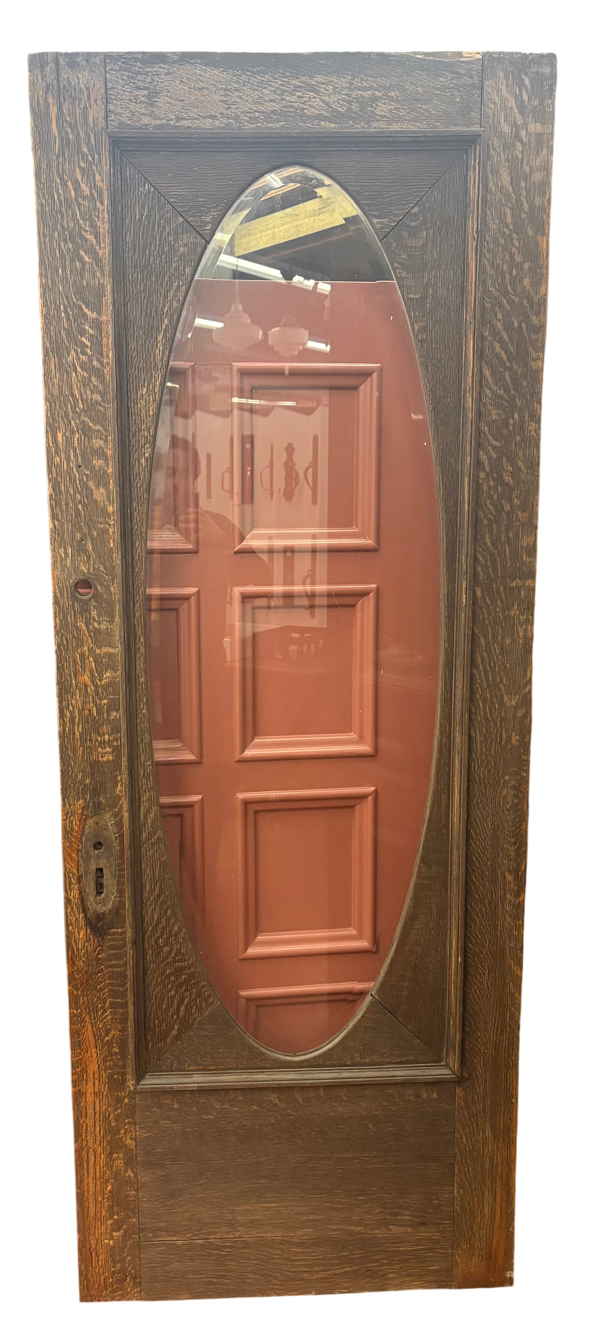 Wooden door with an oval glass panel in a store setting