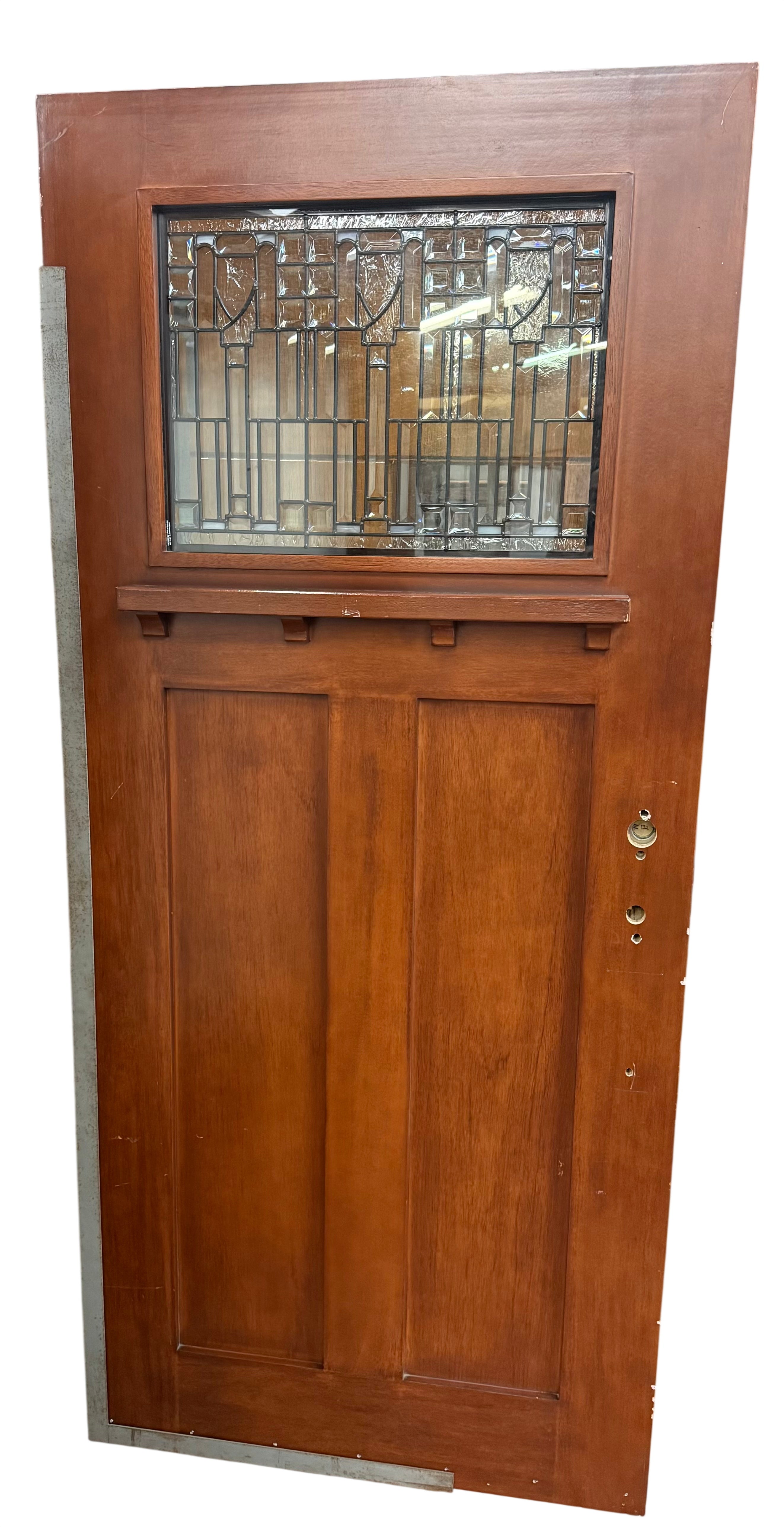 Wooden door with stained glass window in a storage setting