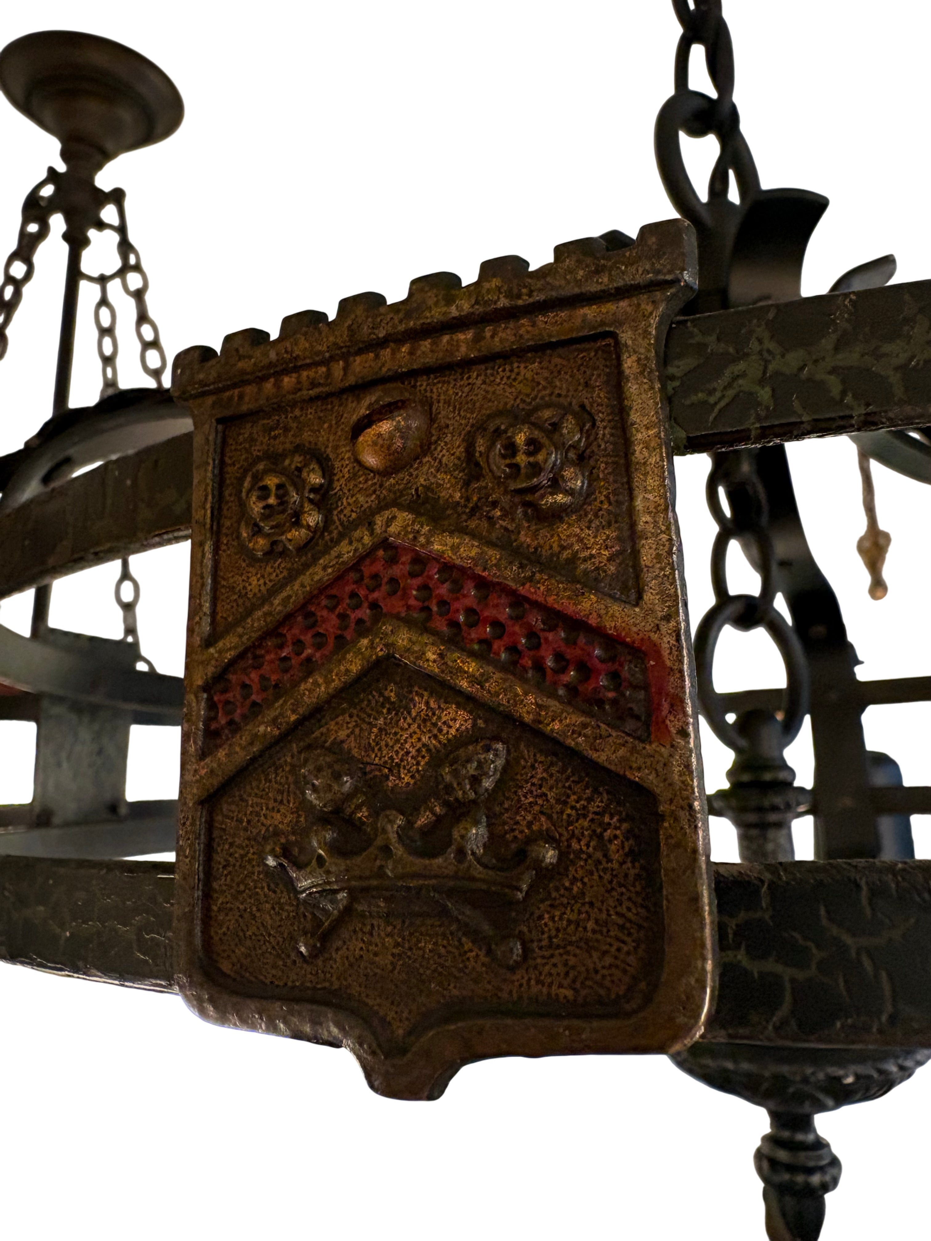 Spanish Revival style chandelier with hand-worked iron frame and milk glass globe shades, 1920s–1930s.Chandelier (LT- 1117)